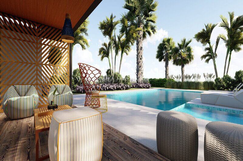 Área externa com mesa, cadeira e piscina
